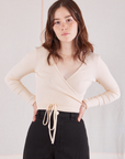 Hana is wearing Wrap Top in Vintage Tee Off-White