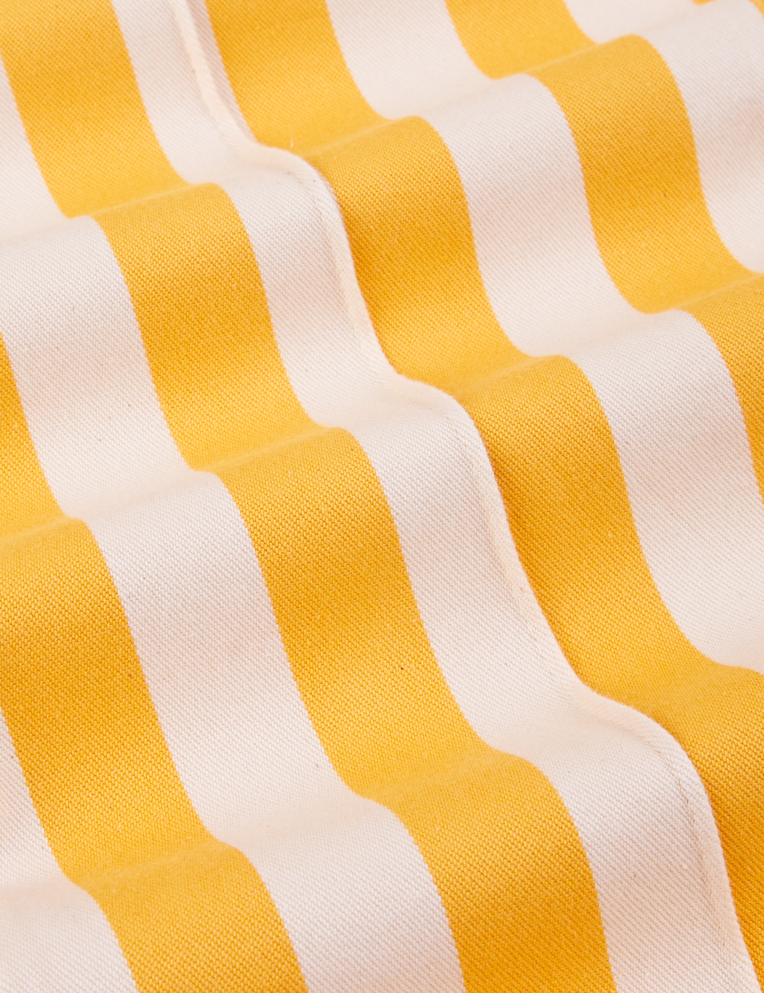 Western Pants in Ketchup/Mustard Stripes fabric close up - yellow and white close up