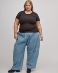 Juliet is wearing Baby Tee in Espresso Brown and light wash denim drop pocket pants