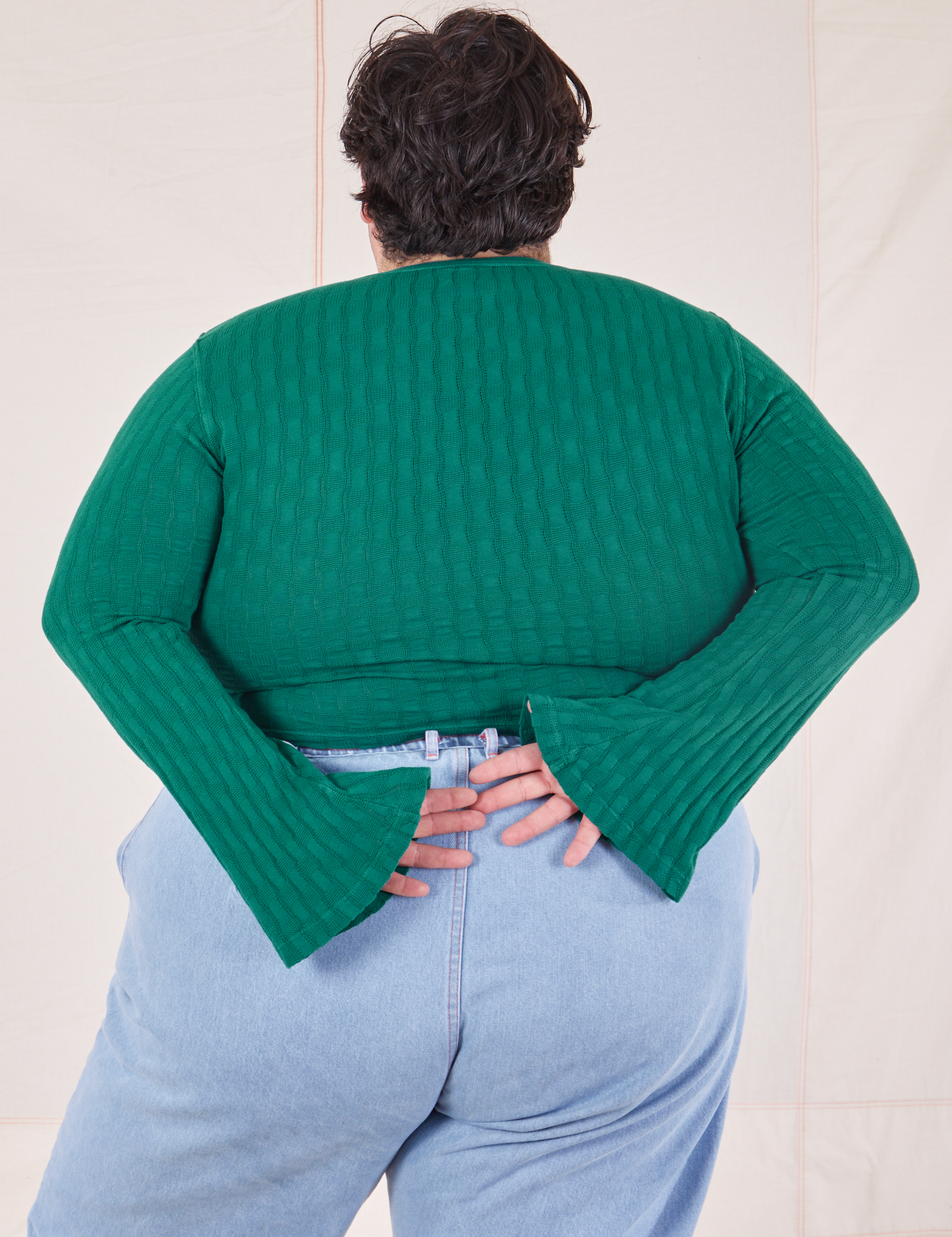 Back view of Bell Sleeve Top in Hunter Green worn by Sam