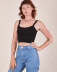 Alex is wearing Cropped Cami in Basic Black and light wash Frontier Jeans