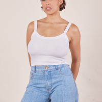 Tiara is wearing Cropped Cami in Vintage Off-White and light wash Sailor Jeans