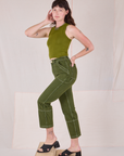Side view of Railroad Carpenter Jeans in Summer Olive and Muscle Tee on Alex