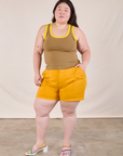 Ashley is wearing Colorblock Cropped Tank in Desert Brown and mustard yellow Work Shorts