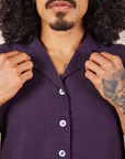 Front close up of Pantry Button-Up in Nebula Purple. Jesse is holding the collar.