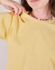 Cropped Burly Tee in Butter Yellow close up on Alex