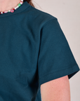 Cropped Burly Tee in Lagoon sleeve close up on Alex