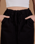 Drop Pocket Cargo Pants in Basic Black front close up on Alex