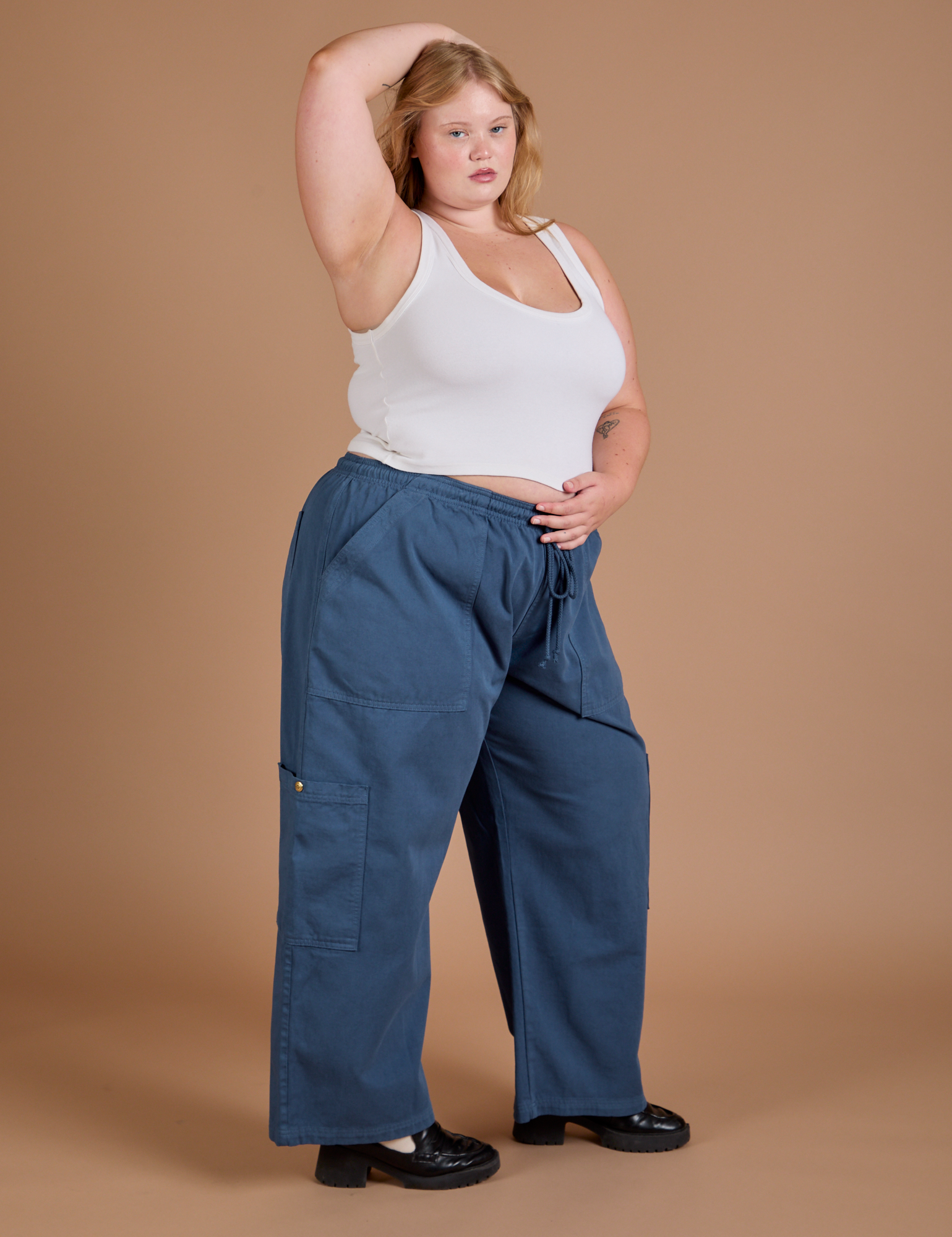 Angled front view of Drop Pocket Cargo Pants in French Blue and Cropped Tank in vintage tee white