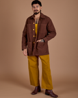 Jesse is wearing Ripstop Field Coat in Fudgesicle Brown and Spicy Mustard Drop Pocket Cargo Pants