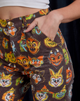 Close up of Alex's hand in the front pocket of Work Pants in Halloween Masks