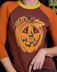 Raglan Tee in Jack-O-Lantern front close up on Alex