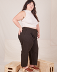 Side view of Heavyweight Trousers in Espresso Brown and vintage off-white Sleeveless Turtleneck worn by Ashley