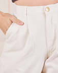 Front pocket close up of Heavyweight Trousers in Vintage Tee Off-White. Alex has her hand in the pocket.