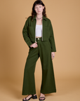 Alex is wearing Heritage Mechanic Jacket in Evergreen and matching Wide Leg Trousers