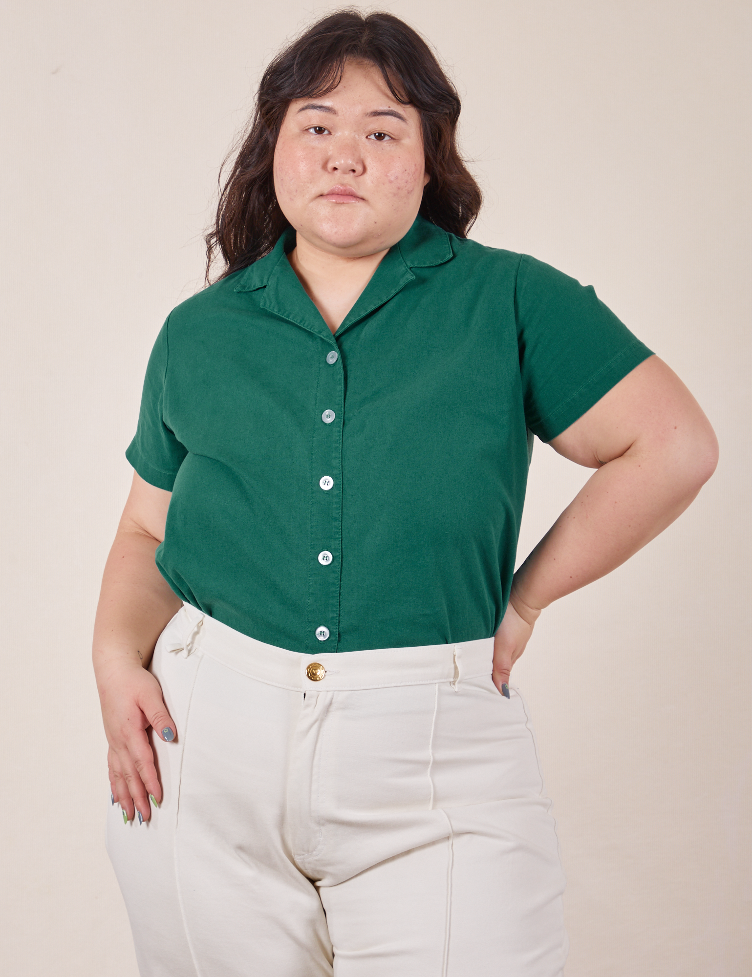 Ashley is wearing Pantry Button-Up in Hunter Green and vintage off-white Western Pants