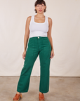 Tiara is wearing Work Pants in Hunter Green and Cropped Tank Top in vintage tee off-white