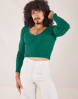 Jesse is wearing Long Sleeve V-Neck Tee in Hunter Green and vintage tee off-white Western Pants