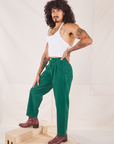 Jesse is wearing Heavyweight Trousers in Hunter Green and Halter Top in vintage tee off-white