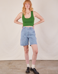 Margaret is wearing Carpenter Shorts in Light Wash and lawn green Cropped Tank