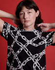 Front close up of Chain Link Vintage Tee in Basic Black on Alex