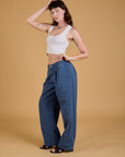 Side view of Baggy Mid-Rise Trousers in French Blue and vintage tee white Cropped Tank on Alex