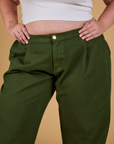 Baggy Mid-Rise Trousers in Evergreen front close up on Juliet