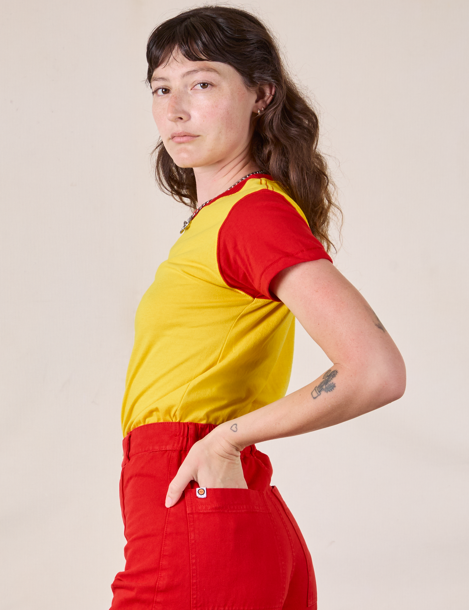 Side view of Mismatched Tee in Yellow & Red on Alex