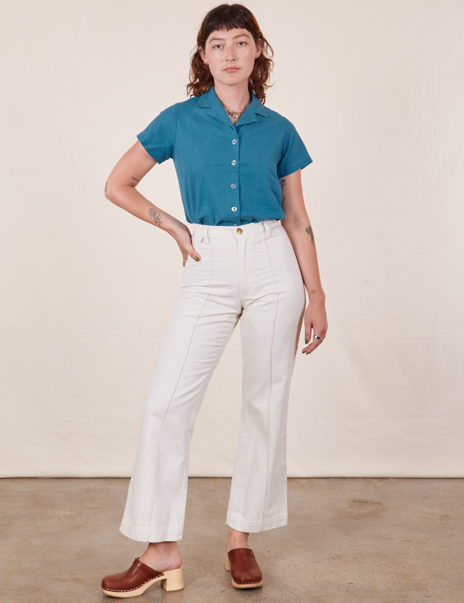 Alex is wearing Pantry Button-Up in Marine Blue and vintage tee off-white Western Pants