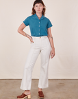 Alex is wearing Pantry Button-Up in Marine Blue and vintage tee off-white Western Pants