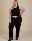 Juliet is wearing Racerback Tank in Black and black Work Pants