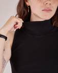 Front close up of Sleeveless Essential Turtleneck in Basic Black on Hana