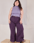 Ashley is wearing Sleeveless Essential Turtleneck in Faded Grape and nebula purple Bell Bottoms