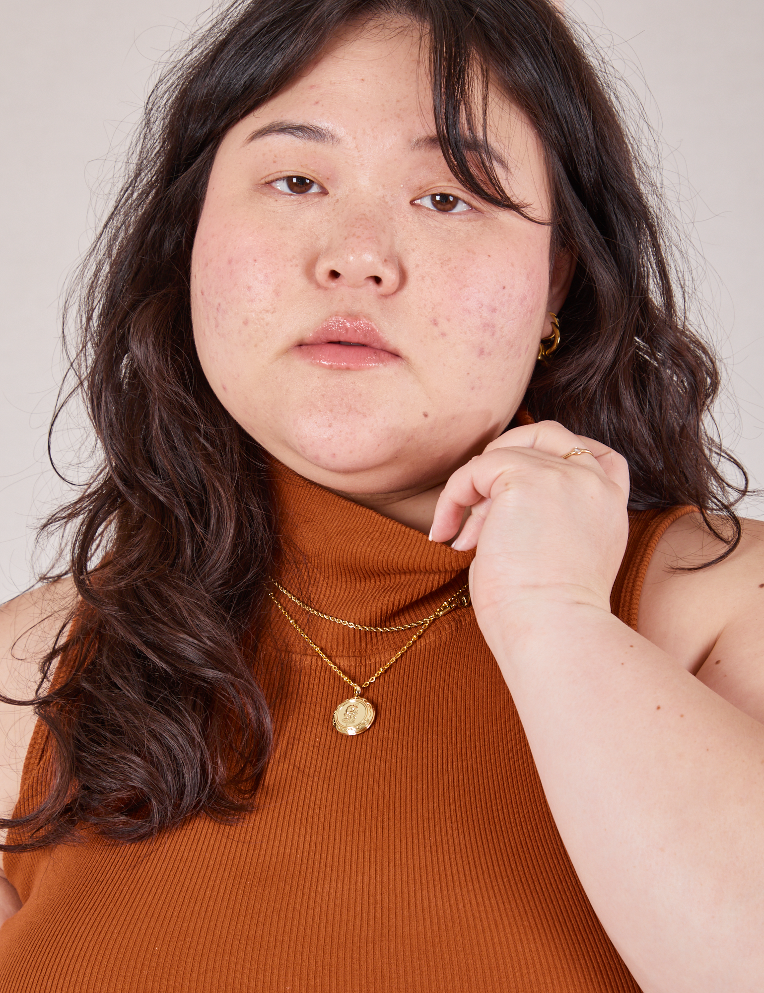 Sleeveless Essential Turtleneck in Burnt Terracotta close up on Ashley