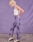 Side view of Paintstamped Work Pants in Grape and Cropped Tank in Vintage Tee Off-White on Madeline