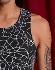 Spider Webs Racerback Tank neckline close up on Anthony