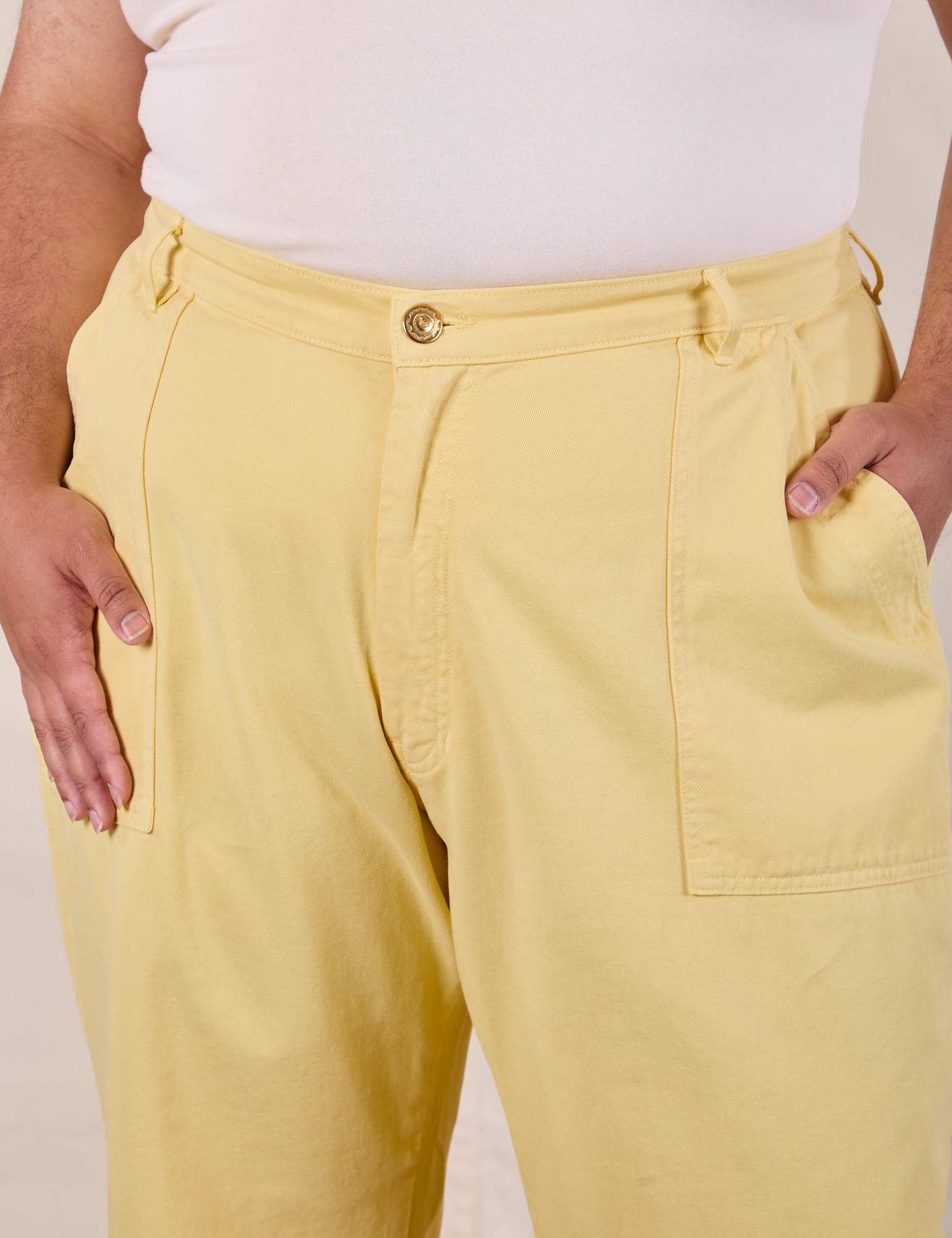 Work Pants in Butter Yellow front close up on Miguel