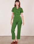 Alex is 5'8" and wearing XS Short Sleeve Jumpsuit in Lawn Green