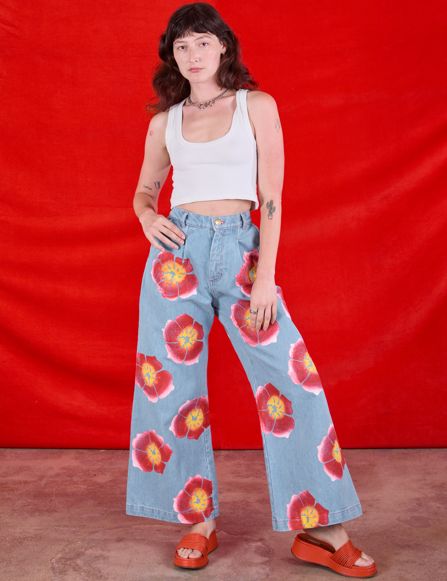 Wide Leg Denim Trousers in Painted Flowers and Cropped Tank in Vintage Tee Off-White worn by Alex