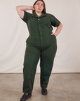 Marielena is 5’8” and wearing 2XL Short Sleeve Jumpsuit in Swamp Green