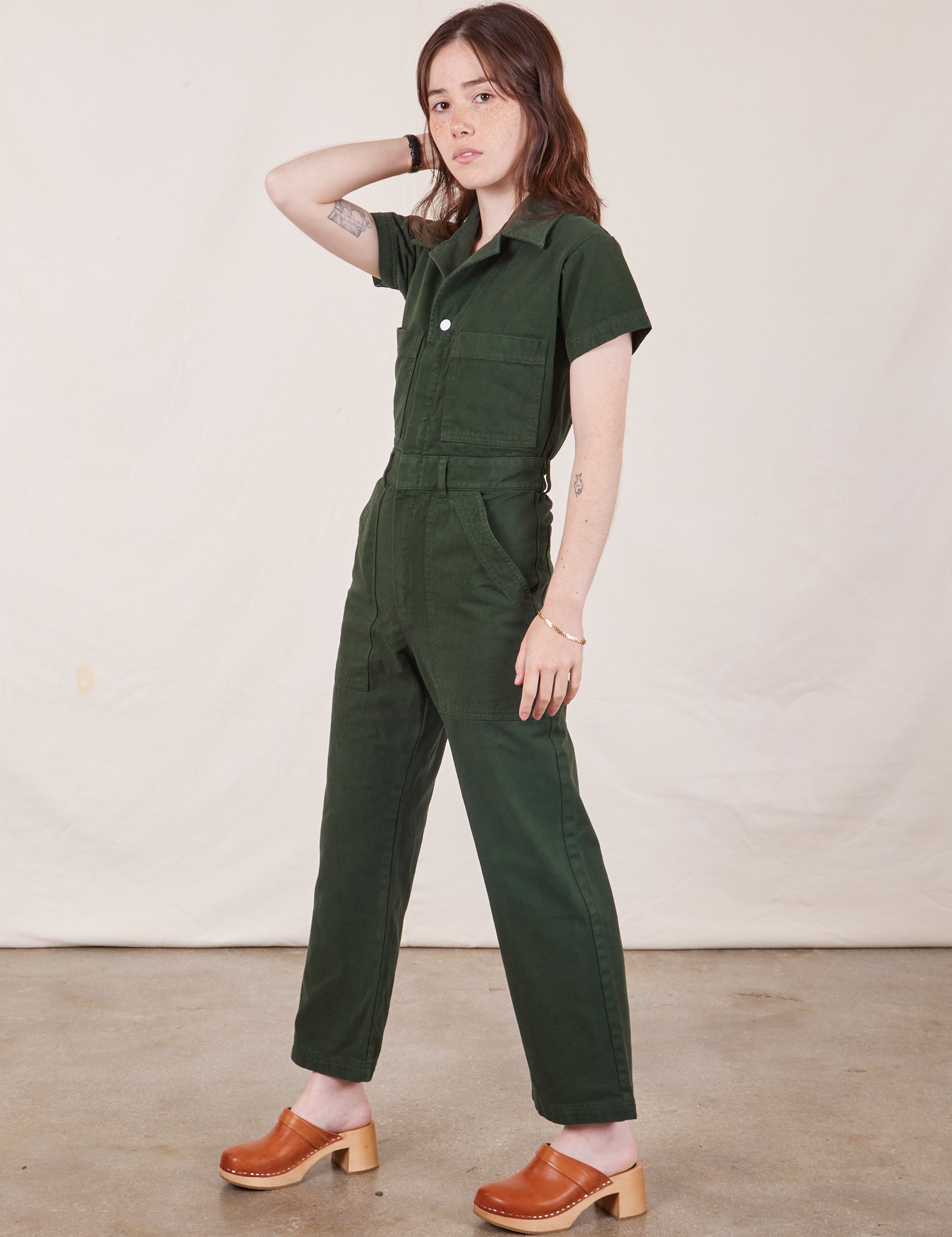 Petite Short Sleeve Jumpsuit in Swamp Green side view on Hana