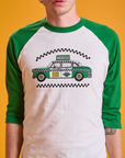Taxi Raglan Tee in Chicago front close up on Quinn. White tee body and green raglan sleeves