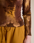 Close up of Long Sleeve Baby Tee in Honey Brown on Alex