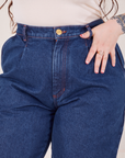 Front close up of Denim Trouser Jeans in Dark Wash. Sydney has her thumb in the belt loop.