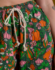 Drop Pocket Cargo Pants in Kitchen Collection front close up. Natural colored drawstring tied in bow