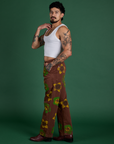 Side view of Floral Painted Work Pants in Brown and Cropped Tank in Vintage Tee White on Jesse