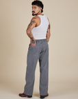 Angled back view of Work Pants in Washed Grey and vintage tee white Cropped Tank on Jesse