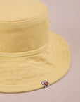 Wide Brim Denim Bucket Hat in Butter Yellow close up