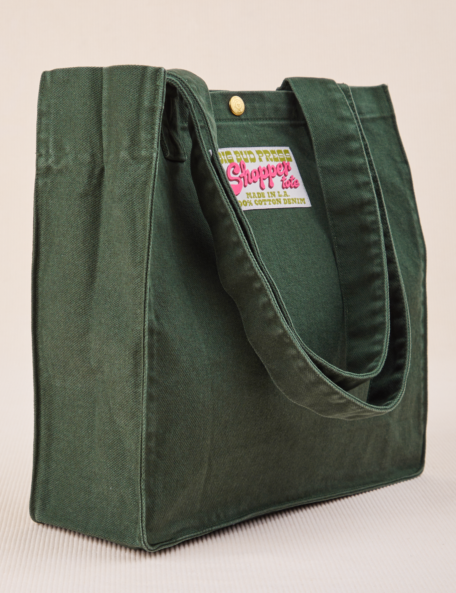 Angled view of Shopper Tote Bag in Swamp Green