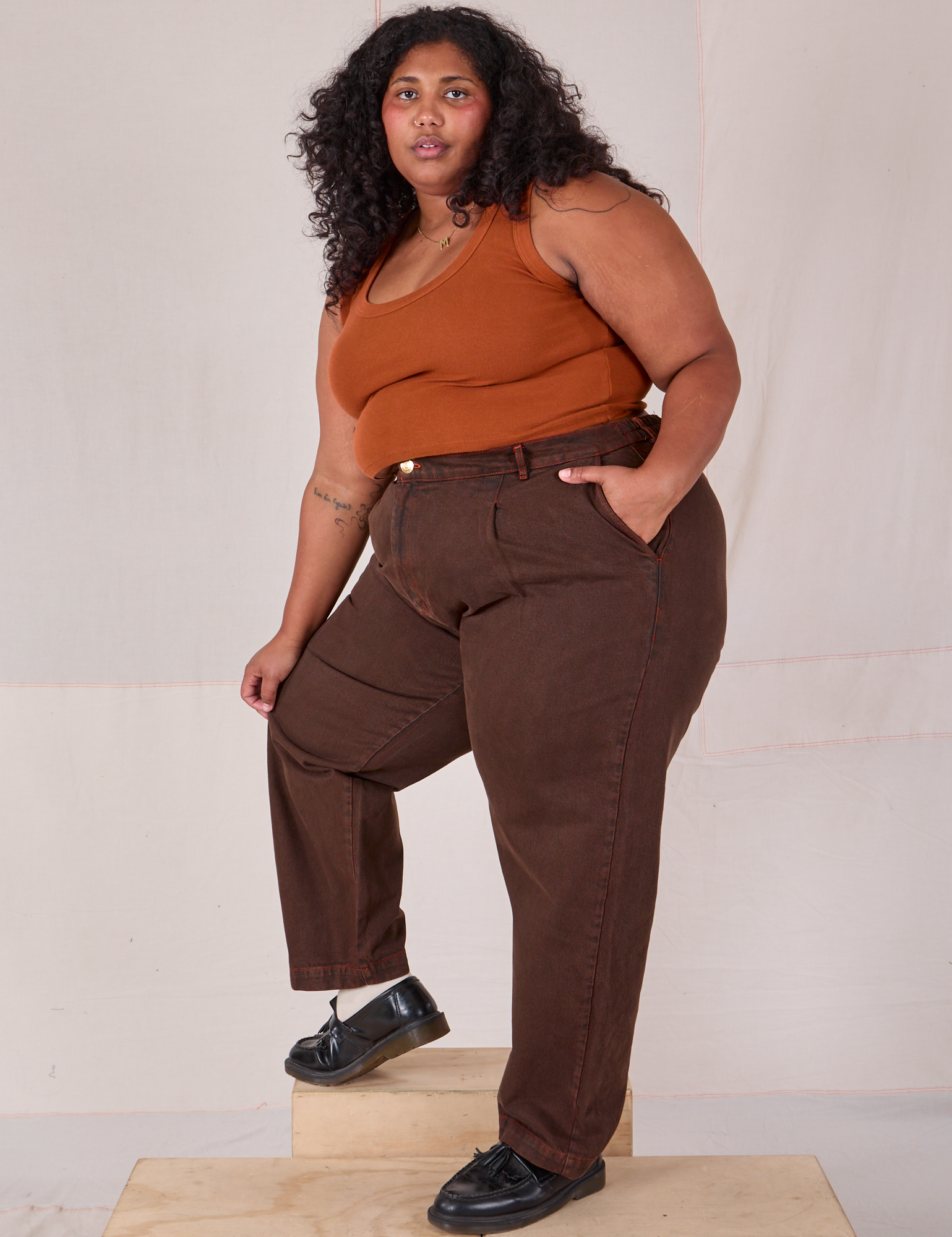 Side view of Overdyed Denim Trouser in Fudge and burnt terracotta Cropped Tank on Morgan